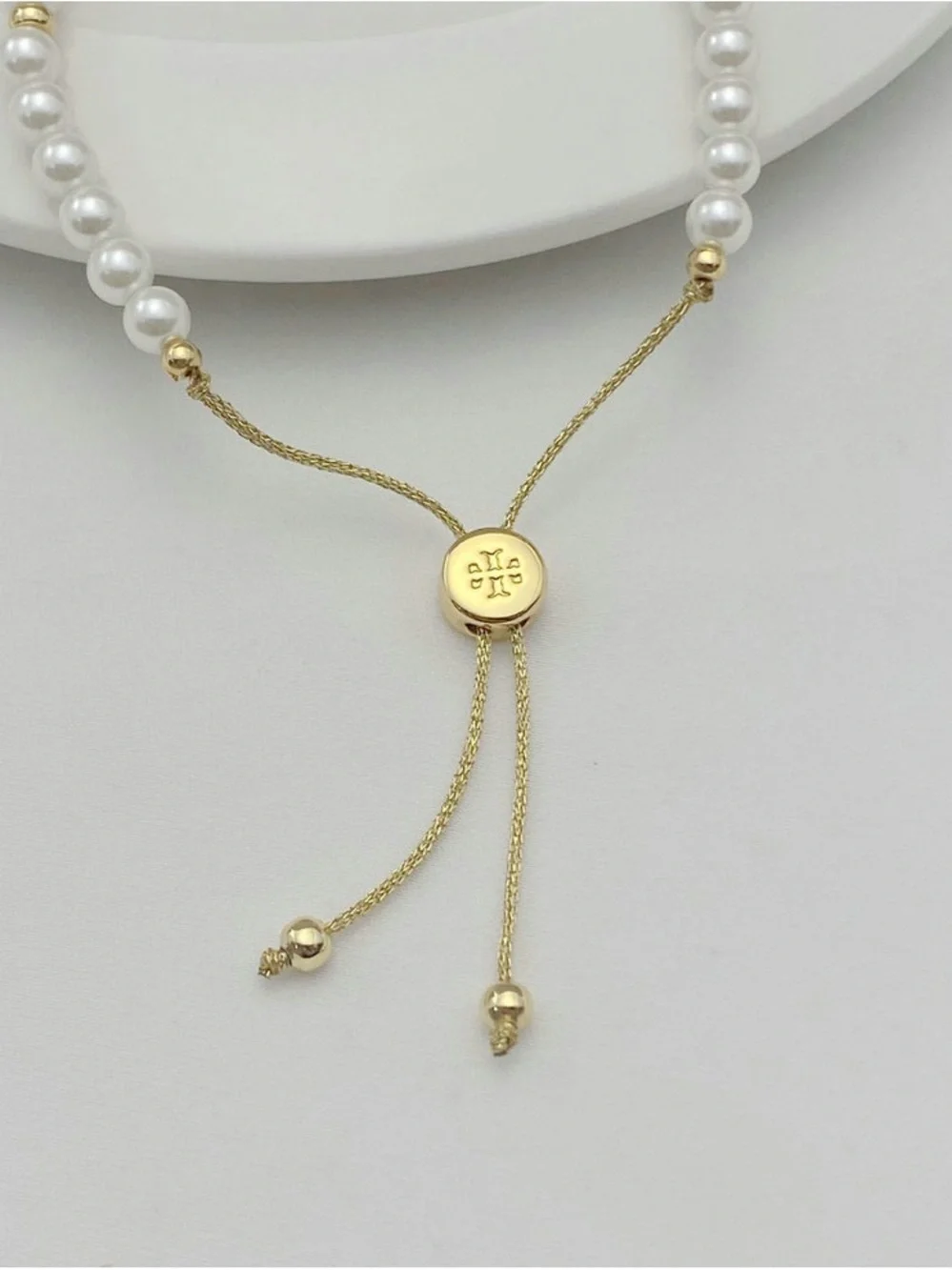Tory Burch Gold and White Pearl Logo Adjustable Bracelet